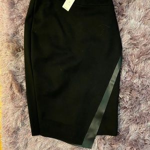 Asymmetrical black skirt with leather detail